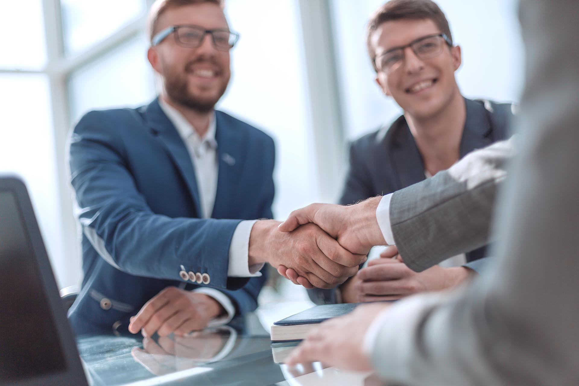 Business professionals shaking hands.