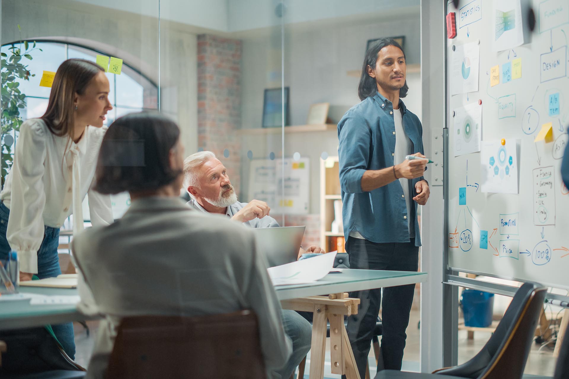 Multiethnic Business Team Discussing Strategy in a Meeting Room