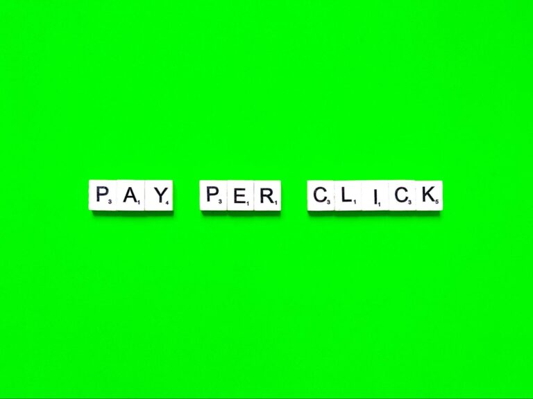 Word “pay per click” written on word tiles.