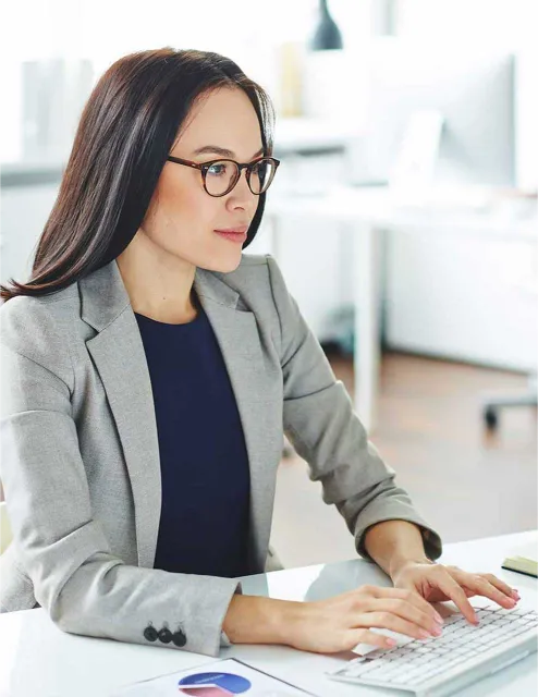 Woman with eye glasses working in the office